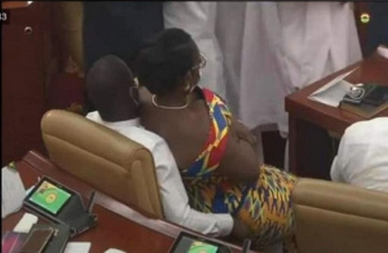 Married Ghanaian politician, Mrs. Ursula Owusu-Ekuful is seen comfortably sitting on another man