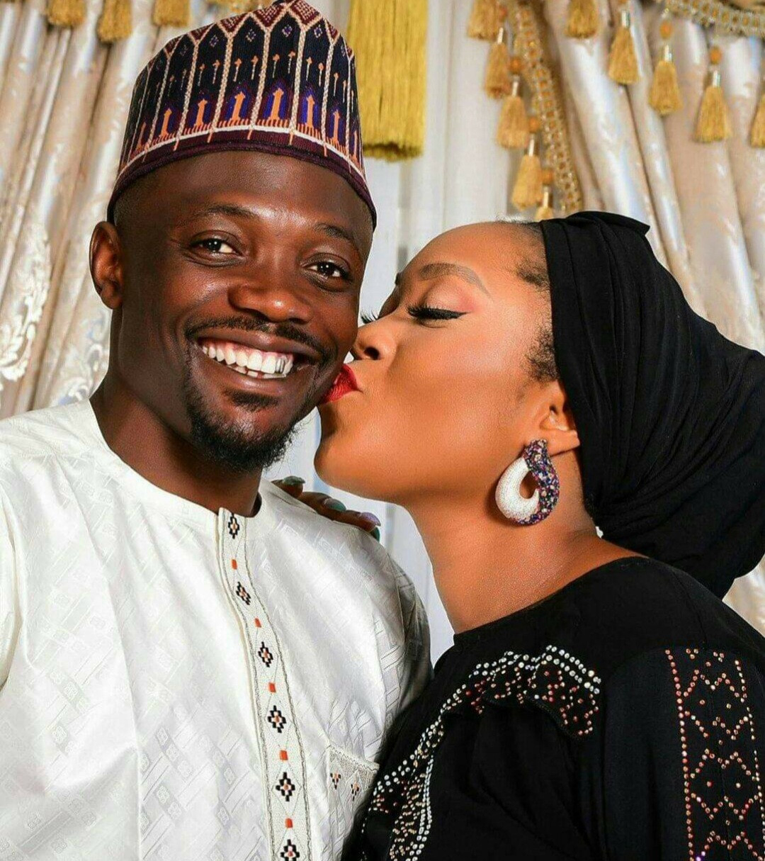 Ahmed Musa called out by Muslims for posting photo of his wife kissing him on the cheek