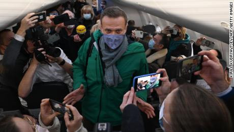 Russian opposition leader Alexey Navalny immediately arrested on return to Moscow five months after being allegedly poisoned by the government