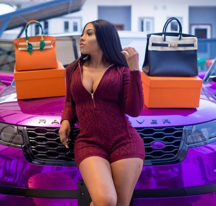 Mercy Eke poses with two Hermes Bags she received as Valentine gifts from her man