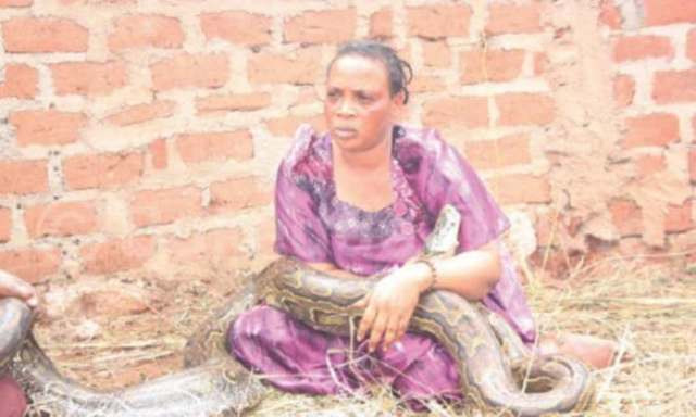Woman caught breastfeeding a snake 