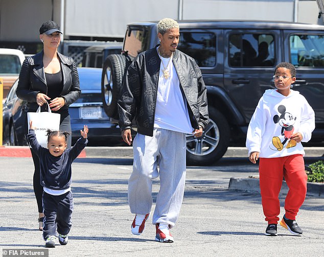 Blended family: Amber Rose and boyfriend Alexander 'AE' Edwards stepped out with their son Slash Electric, two, and her eight-year-old little boy Sebastian in Bel-Air on Tuesday