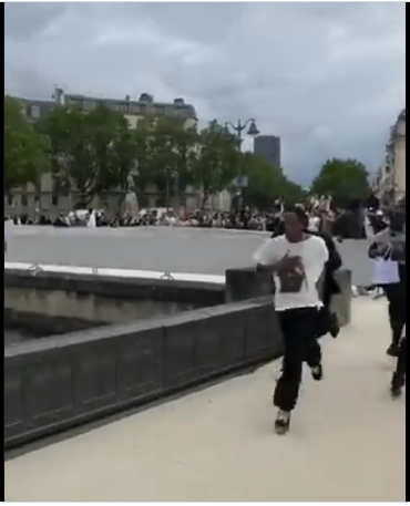 Watch the moment Travis Scott took to his heels after his fans broke down a barricade at his fashion event in Paris (video)