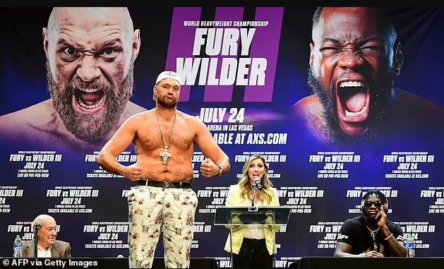  Tyson Fury tests positive for Covid-19 as Deontay Wilder fight is postponed
