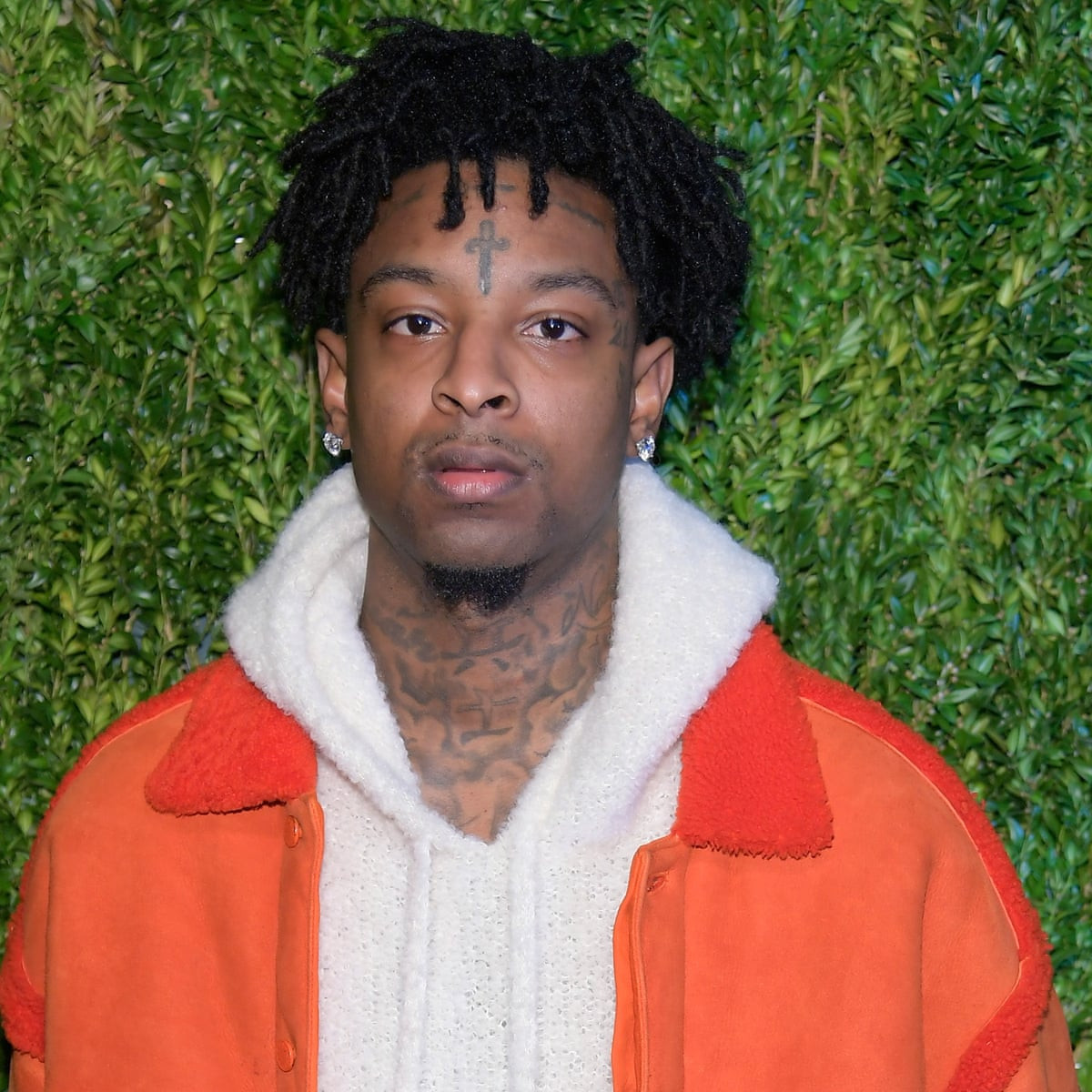 Rapper 21 Savage turns himself in after being charged with gun and drug possession in ICE case 