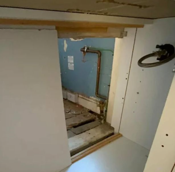 Couple find opening in their kitchen cupboard leading to a mystery