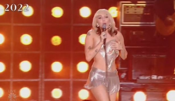 Miley Cyrus suffers wardrobe malfunction as her skimpy top breaks and partly falls off on stage