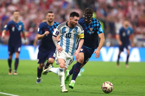 Lionel Messi of Argentina competes with Josko Gvardiol of Croatia during the FIFA World Cup Qatar 2022 semi final match between Argentina and Croatia at Lusail Stadium on December 13, 2022