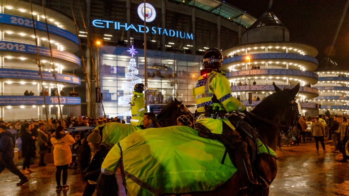 Police look on ahead of Manchester City's EFL Cup tie against Liverpool