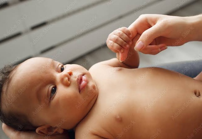 What it means for a baby to hold your finger tightly when touched