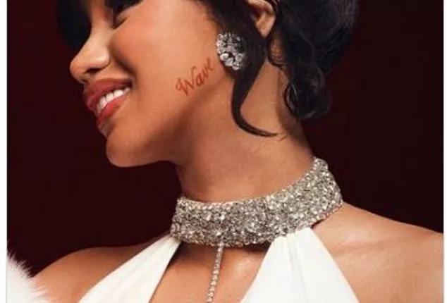 Cardi B insists she has no regrets about shock new tattoo on her JAW and shares first close up look